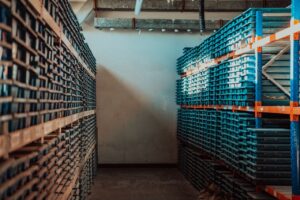 gold-mining-storage-rock-core-samples-geology-drilling-industry-large-ore-warehouse-modern-industry-ores-stacked-boxes-selective-focus-high-quality-photo Large